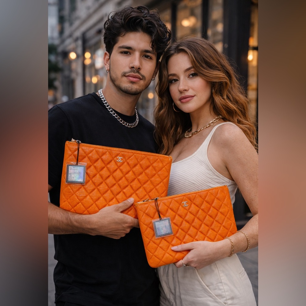 Chanel orange perforated quilted leather O case clutch pouch